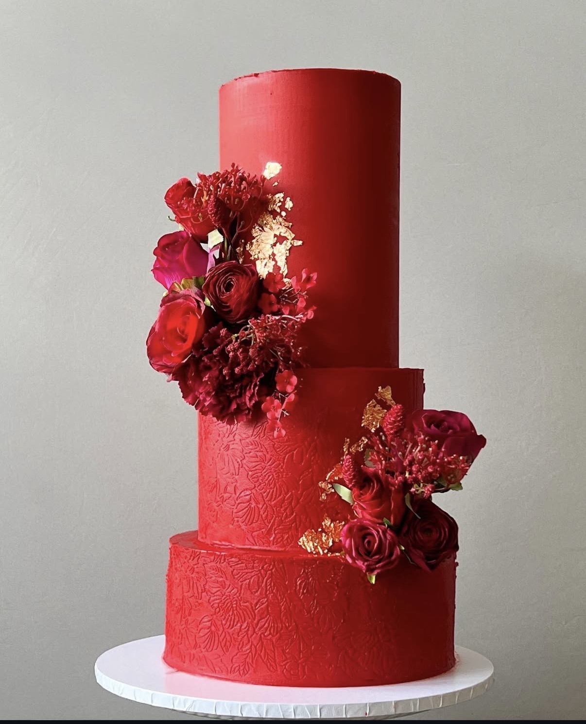 Applying ganache to a tall cake